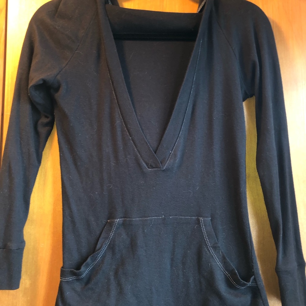 BLACK SHIRT WITH A  DEEP V NECK LINE AND A HOOD